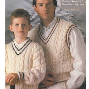 May include: Two people wearing white cable knit sweaters with black and brown trim. The person on the left is wearing a long-sleeved sweater and the person on the right is wearing a sleeveless sweater. The text "DK / 8 Ply 28 to 46 inch Cricket Sweater & Sleeveless Slipover" is in the top right corner of the image.