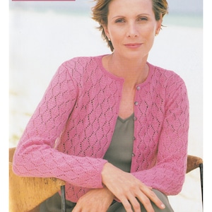 May include: A pink lace cardigan with a diamond pattern. The cardigan is 32 to 42 inches in length. 4 Ply / Fingering Yarn.