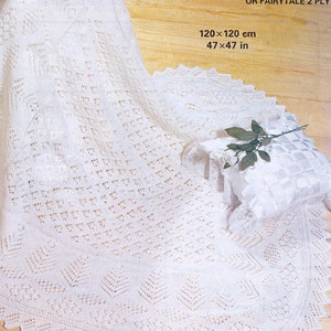 May include: A white crocheted baby blanket with a delicate lace pattern. The blanket is 47 x 47 inches and is made with Patons Fairytale 3 ply yarn.