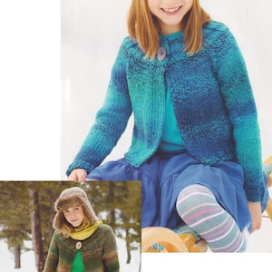 May include: Two girls wearing colourful knitted cardigans. The cardigan on the left is brown, green and beige. The cardigan on the right is blue and green. Both cardigans have a single button closure.