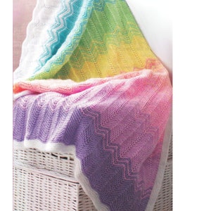 May include: A rainbow colored crochet baby blanket with a chevron pattern. The blanket is made with DK weight yarn and measures 30 x 41.5 inches.