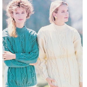 May include: Two women wearing knitted sweaters with cable knit patterns. The sweater on the left is teal blue and the sweater on the right is white. The text on the image reads "Aran / Worsted / 10 Ply 30/32 to 38/40 ins".