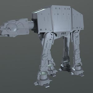 Puede incluir: Un modelo gris detallado de un caminante AT-AT, un vehículo ficticio del universo de Star Wars. El modelo está posado con las piernas extendidas, como si caminara.