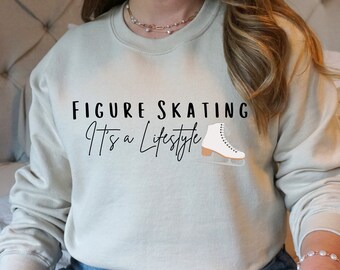 May include: A light beige sweatshirt with the text "FIGURE SKATING It's a Lifestyle" and a white figure skate graphic.