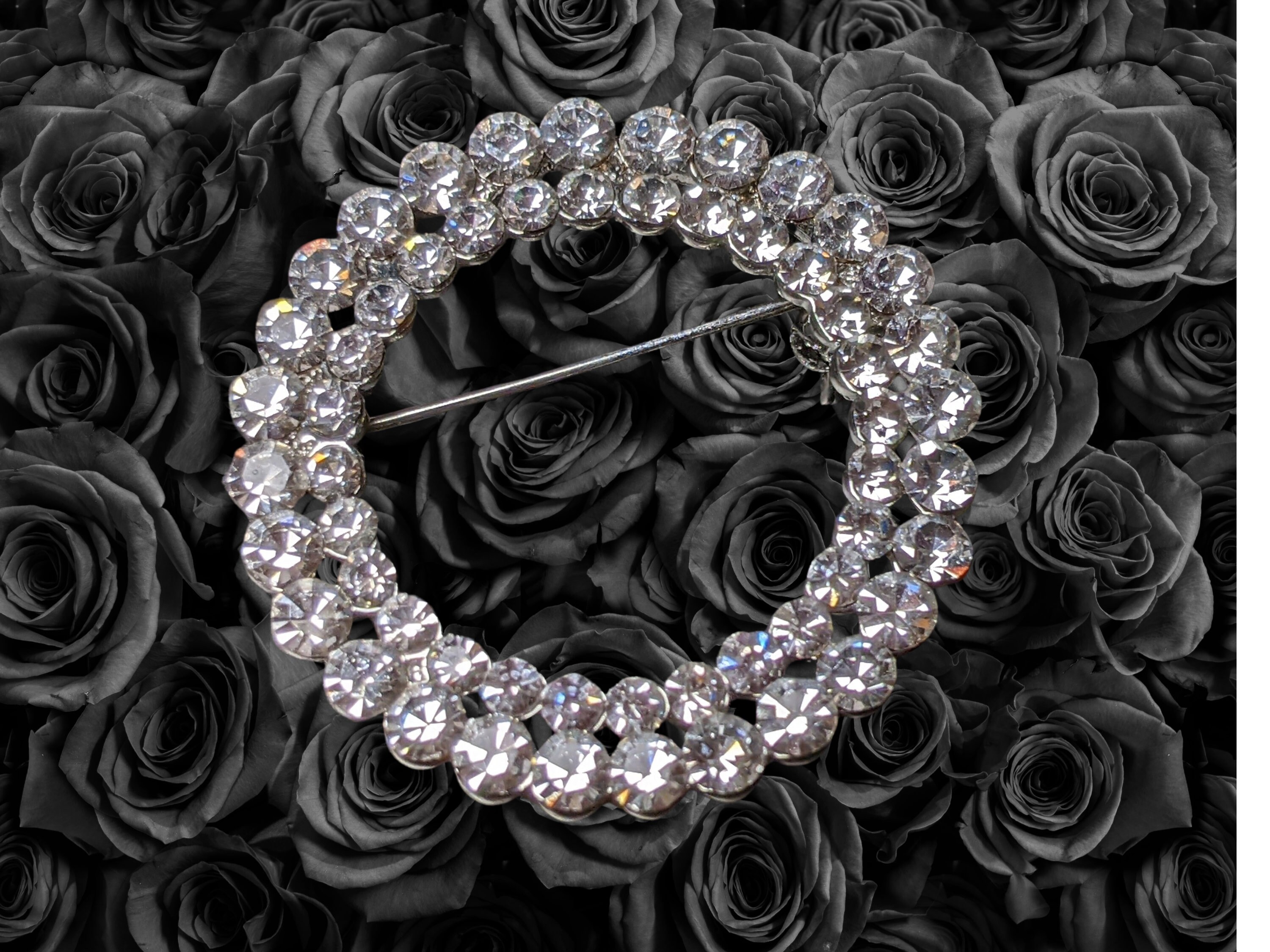 Vintage brooch 1 1/2" round filled with little rhinestones.