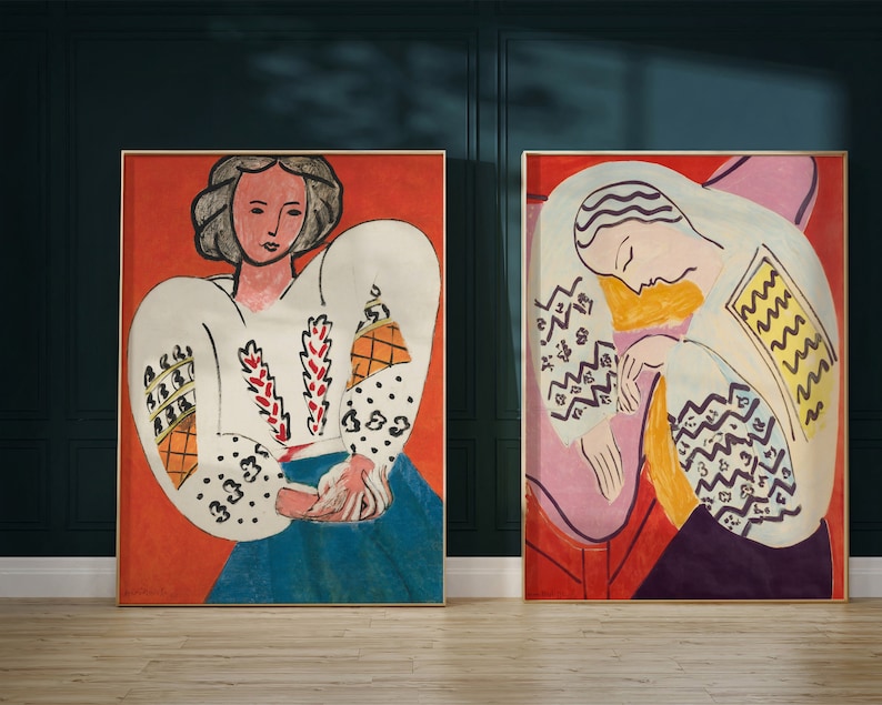 May include: Two framed paintings of women in a cubist style. The painting on the left features a woman with short, dark hair wearing a white blouse with a geometric pattern. The painting on the right features a woman with long, dark hair wearing a white blouse with a geometric pattern.