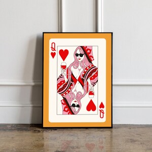 May include: A playing card featuring the Queen of Hearts. The Queen is depicted wearing sunglasses and holding a glass of wine. The card has a red and white design with hearts and a black border.