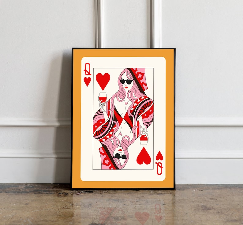 May include: A playing card featuring the Queen of Hearts. The Queen is depicted wearing sunglasses and holding a glass of wine. The card has a red and white design with hearts and a black border.
