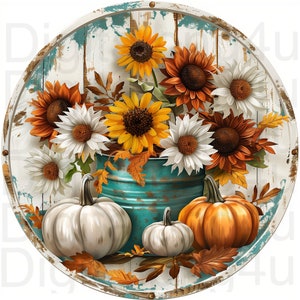 May include: A round, rustic wooden sign with a whitewashed background. A turquoise metal bucket filled with sunflowers, white daisies, and orange mums. Three white pumpkins and one orange pumpkin sit in front of the bucket.