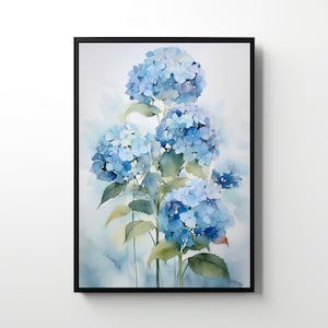 May include: A framed watercolour print of blue hydrangea flowers. The artwork depicts the flowers in shades of blue, with green leaves and stems. The print is set against a soft, light blue and white background, framed in a black border.