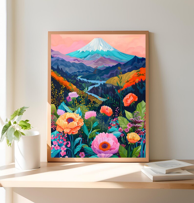 Puede incluir: Una impresi&oacute;n art&iacute;stica enmarcada que presenta un paisaje monta&ntilde;oso con una cima nevada, un r&iacute;o y flores coloridas. La obra de arte utiliza una paleta de naranja, rosa, azul y verde, creando una escena vibrante y atractiva.