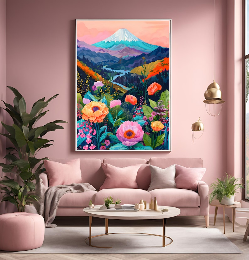 Puede incluir: Una impresi&oacute;n art&iacute;stica enmarcada que representa un vibrante paisaje monta&ntilde;oso con una cima nevada, un r&iacute;o sinuoso y flores coloridas. La obra de arte presenta una paleta de rosas, naranjas, azules y verdes, creando una escena animada. La impresi&oacute;n se exhibe sobre un sof&aacute; rosa.