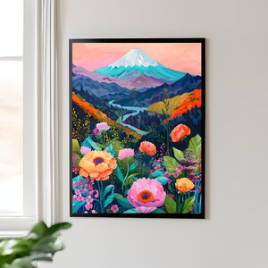Puede incluir: Una impresi&oacute;n art&iacute;stica enmarcada que presenta un paisaje vibrante. La obra de arte representa una monta&ntilde;a nevada, un r&iacute;o sinuoso y flores coloridas en primer plano. La paleta de colores incluye tonos de rosa, naranja, azul y verde, creando una escena alegre.