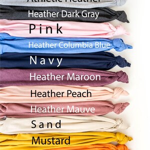 a large group of different colored shirts