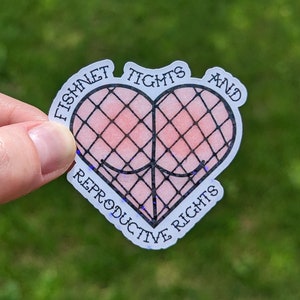 May include: A heart-shaped sticker with the words "FISHNET TIGHTS AND REPRODUCTIVE RIGHTS" in a circular font. The heart design features a fishnet pattern over a pink background.