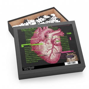 May include: A jigsaw puzzle in a black box featuring a pink anatomical heart illustration over a black background with green binary code and a small owl wearing virtual reality goggles. The box lid text reads 11x14 Puzzle 252 pcs Ages 9+.