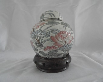 Famille Rose ginger jar on a wooden plinth 1990s