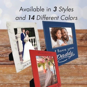 May include: Three different styles of picture frames with personalized engravings. The frames are made of faux leather and have a stitched border. The frames are available in 14 different colors. The first frame is white with a marble pattern and the engraving "JACK &". The second frame is blue with the engraving "I love you Daddy". The third frame is red with the engraving "Secret Garden Gala" and "Masin High School".