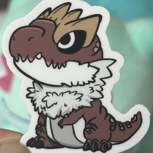 May include: A brown and white cartoon dinosaur with a fluffy white collar. The dinosaur has a large, black eye and a toothy grin.