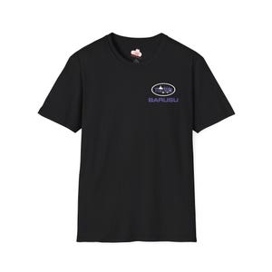 May include: A black short-sleeved t-shirt featuring a small graphic on the left chest. The graphic consists of a white oval containing purple text and a small white icon, with the word BARUSU printed in bold purple capital letters underneath.
