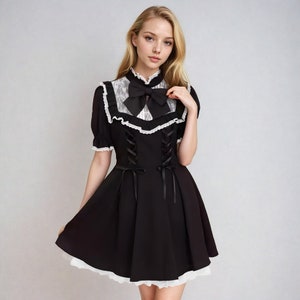 black jirai kei dress with lace ruffles and black bow jirai kei fashion jirai kei clothes, j-fashion, japanese fashion, harajuku fashion, ryousangata, girly kei, dark girly, lolita fashion, casual lolita, himekaji, pastel goth, cutecore