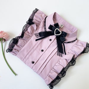 close view of a cute pink jirai kei blouse ruffle with lace details buttoned and bow with heart bead, jirai kei fashion, jirai kei clothes, j-fashion, jfashion, japanese fashion, ryousangata, casual lolita, yami kawaii, gift idea for her girlfriend