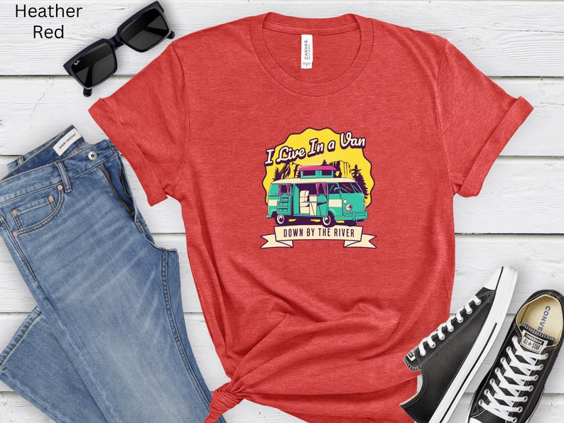 May include: Red heather t-shirt with a graphic of a vintage van with the text "I Live In A Van Down By The River".
