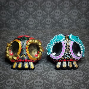 Day of Dead skulls, polymer clay, plaster cast. One of a kind item.