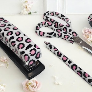 Complete white and pink leopard print resin desk set.