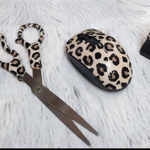 Tan and brown leopard print desk set.