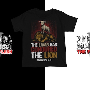 May include: Black t-shirt with a graphic featuring a lamb standing on a lion, with the text "THE LAMB HAS CONQUERED THE LION" and "REVELATION 17:14". The phrase "REBEL AGAINST THE FLESH" is also displayed.