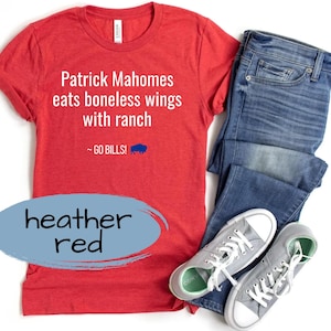 May include: Red heather t-shirt with the text "Patrick Mahomes eats boneless wings with ranch ~ GO BILLS!" printed on it.