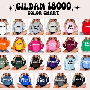 May include: Color chart for Gildan 18000 sweatshirts, showing 18 different colors, including white, ash, sport grey, sand, light pink, red, orange, gold, heliconia, safety pink, maroon, Irish green, military green, forest green, dark chocolate, purple, light blue, Carolina blue, indigo, royal blue, navy blue, dark heather, and black.