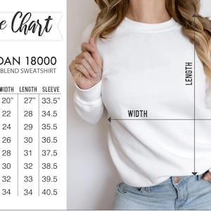 May include: Size chart for a Gildan 18000 heavy blend sweatshirt. The chart shows the size, width in inches, length in inches, and sleeve length in inches.