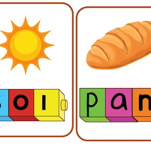 Könnte beinhalten: Zwei Lernkarten. Eine Karte zeigt eine gelbe Sonne und das Wort „sol“ in blauen, roten und gelben Blöcken. Die andere Karte zeigt ein Brotlaib und das Wort „pan“ in grünen, rosa- und orangefarbenen Blöcken.