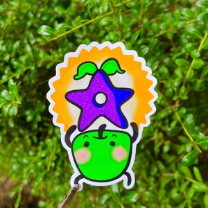 Stardew Valley Junimo Cartoon holding a Stardrop Waterproof sticker