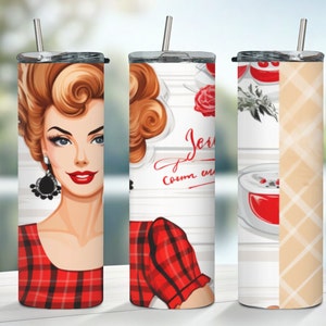 May include: Three stainless steel tumblers with different designs. The first tumbler features a red and black plaid pattern with a woman's face. The second tumbler has a white background with a red rose and the text "Jere Creme en." The third tumbler has a white background with a red and white plaid pattern.