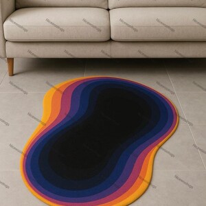 May include: A colorful, abstract rug with a unique shape. The rug features concentric layers of color, transitioning from yellow to orange, purple, and finally, a black center. The rug is placed on a tiled floor in front of a beige sofa.