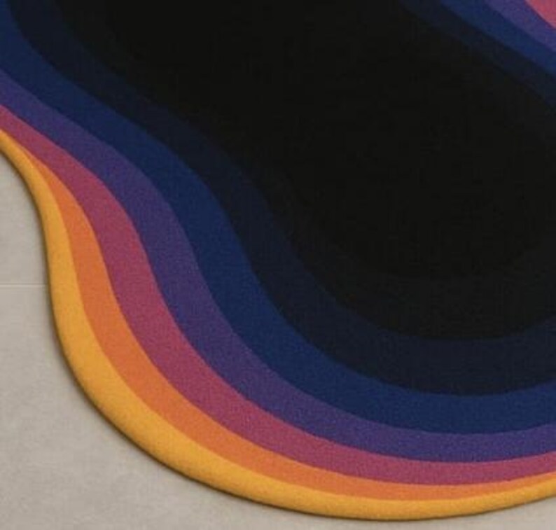 May include: A colorful, abstract rug with a wavy design. The rug features bands of color, including yellow, orange, pink, purple, and blue, transitioning to a black center. The rug's shape is organic and modern.
