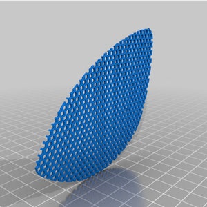 May include: A blue plastic mesh panel with a curved shape. The mesh is made of small, hexagonal holes.