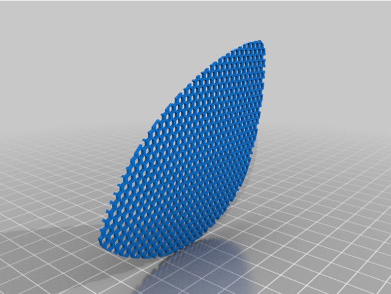 May include: A blue plastic mesh panel with a curved shape. The mesh is made of small, hexagonal holes.