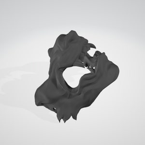May include: A black 3D printed mask with a detailed design resembling a snarling animal face. The mask has a large open mouth and sharp teeth.