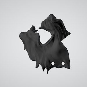May include: A black fabric mask with a jagged edge and two holes. The mask is designed to cover the nose and mouth.
