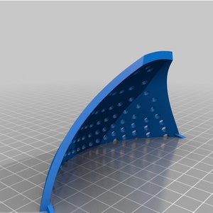 May include: A blue plastic 3D printed object with a curved shape and a grid of holes. The object is designed to be used as a diffuser for a light source.