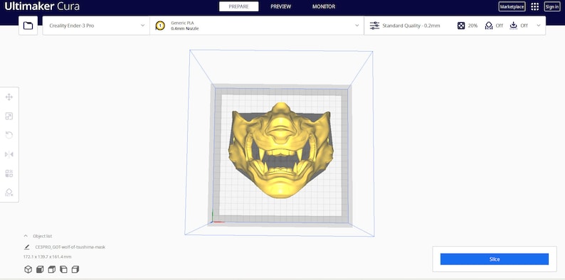 May include: A 3D model of a gold-colored mask with a fierce expression, displayed in a 3D printing software interface. The software interface shows the mask in a virtual print bed, ready to be sliced and printed.