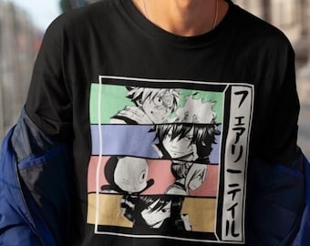 May include: A black t-shirt with a colorful graphic print of anime characters. The graphic features four characters in a grid pattern with a Japanese text that reads "Fairy Tail".