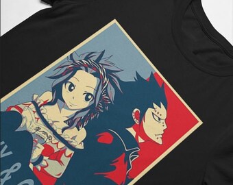May include: A black t-shirt with a graphic of two anime characters, a woman with pink hair and a man with black hair, in a red, white, and blue poster style design. The text "Levy & Gajeel" is at the bottom of the graphic.