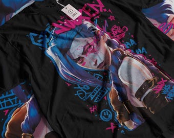 May include: Black t-shirt featuring a colourful graphic of a female character with blue hair and pink and blue accents. The text "GET WRECKED!" is printed on the shirt.