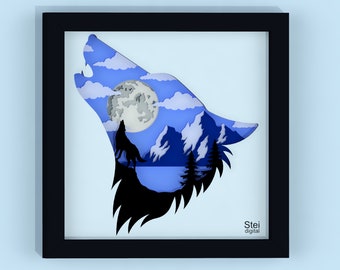 May include: A paper cut-out art piece depicting a wolf howling at the moon. The wolf's silhouette is black, and the moon and sky are blue. The background features a mountain range and a lake. The art piece is framed in black.