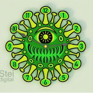 May include: A green and yellow clock shaped like a virus with a black eye in the center. The clock hands are black and the numbers are green. The text "Stei digital" is at the bottom of the clock.